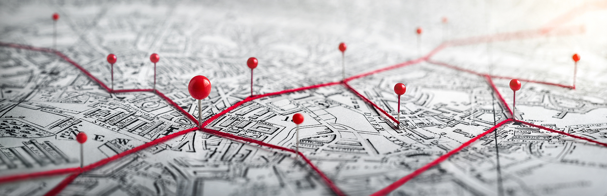 A map with lines and pins on it