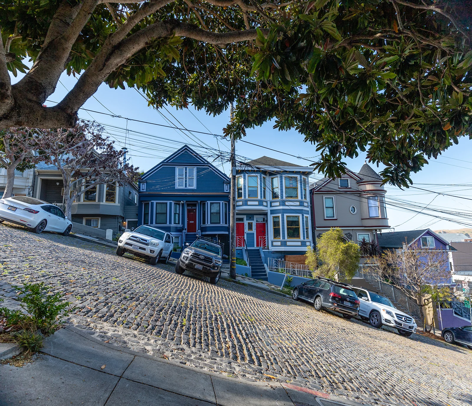 Steep Coblestone street with big hill near Custom Fit