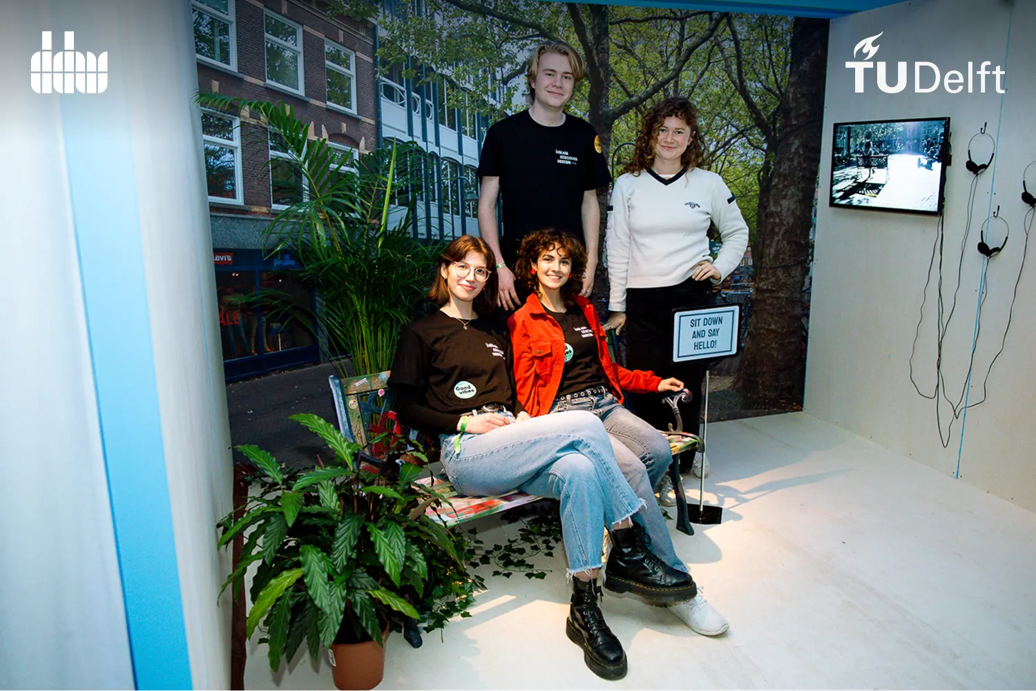 Four TU Delft students posing in their exhibition booth at Dutch Design Week 2023.