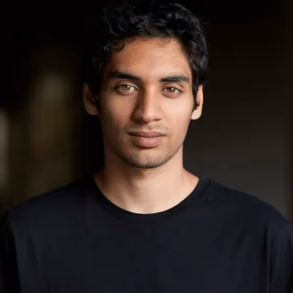 Professional headshot photo of Mika Kalathil, Chief Architect at Blitz.gg and creator of learn-elixir.dev