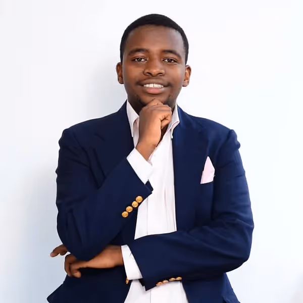 Professional headshot photo of Michael Munavu, Founder and Software Engineer with background in Elixir, Ruby, and React