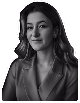 Black and white portrait of a woman with long hair wearing a blazer and earrings.