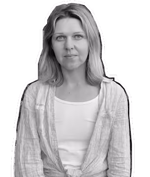 Portrait of a woman with shoulder-length hair wearing a light jacket over a white top.