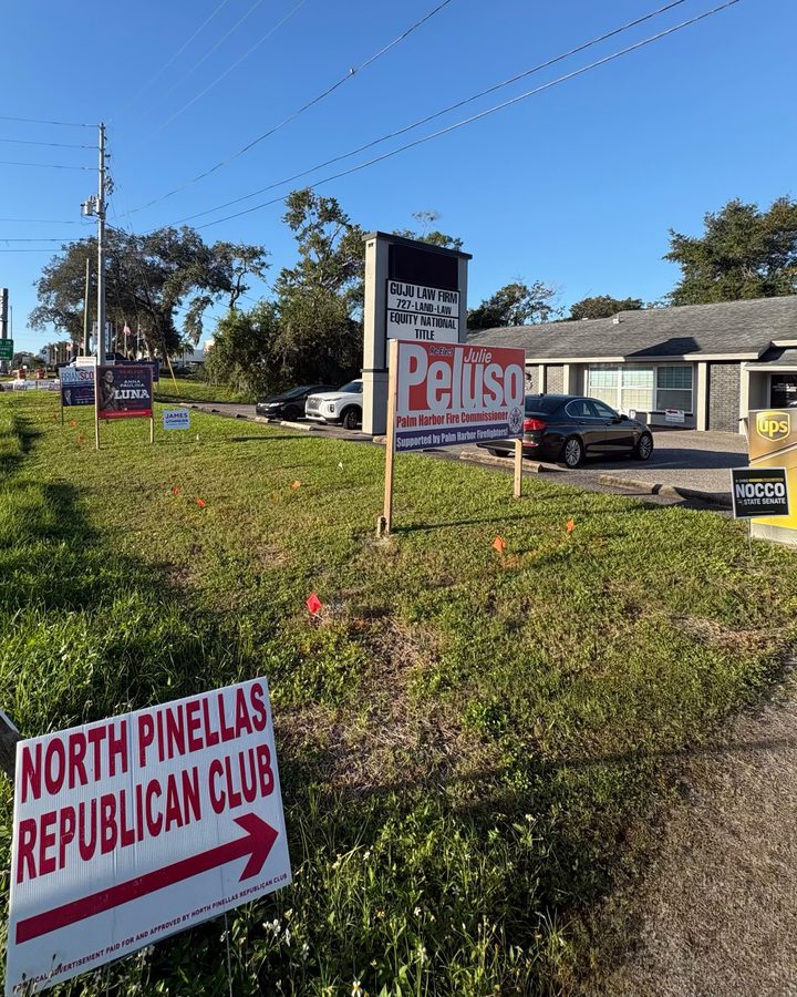 The Campaign Office at the Guju Law Firm sign on U.S. Highway 19 North