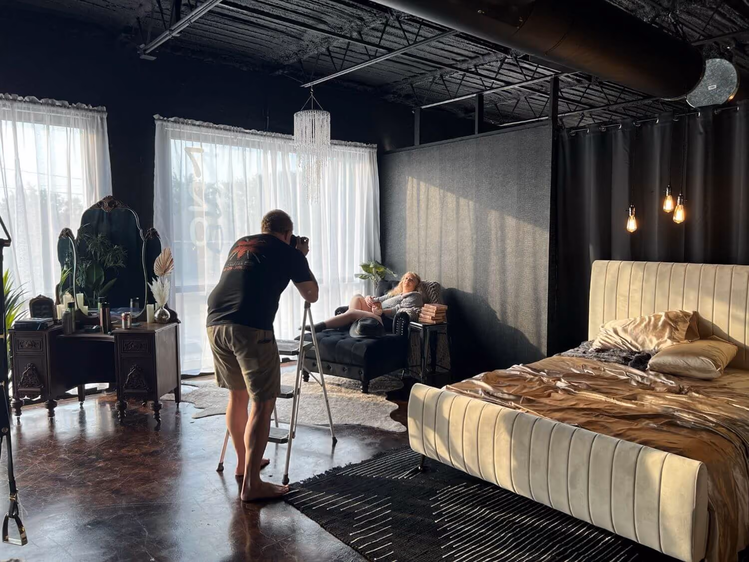 Allan Pickering of Steamy Esteem Boudoir photographing senior woman lounging on a chair in the studio.