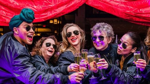First preview with cast members (left to right) Lilli Cooper, Rachel Dratch, Julianne Hough, Julie White, and Suzy Nakamura. Women are wearing matching aviator sunglasses, bomber jackets, and clinking champagne flutes with a celebratory cheers.