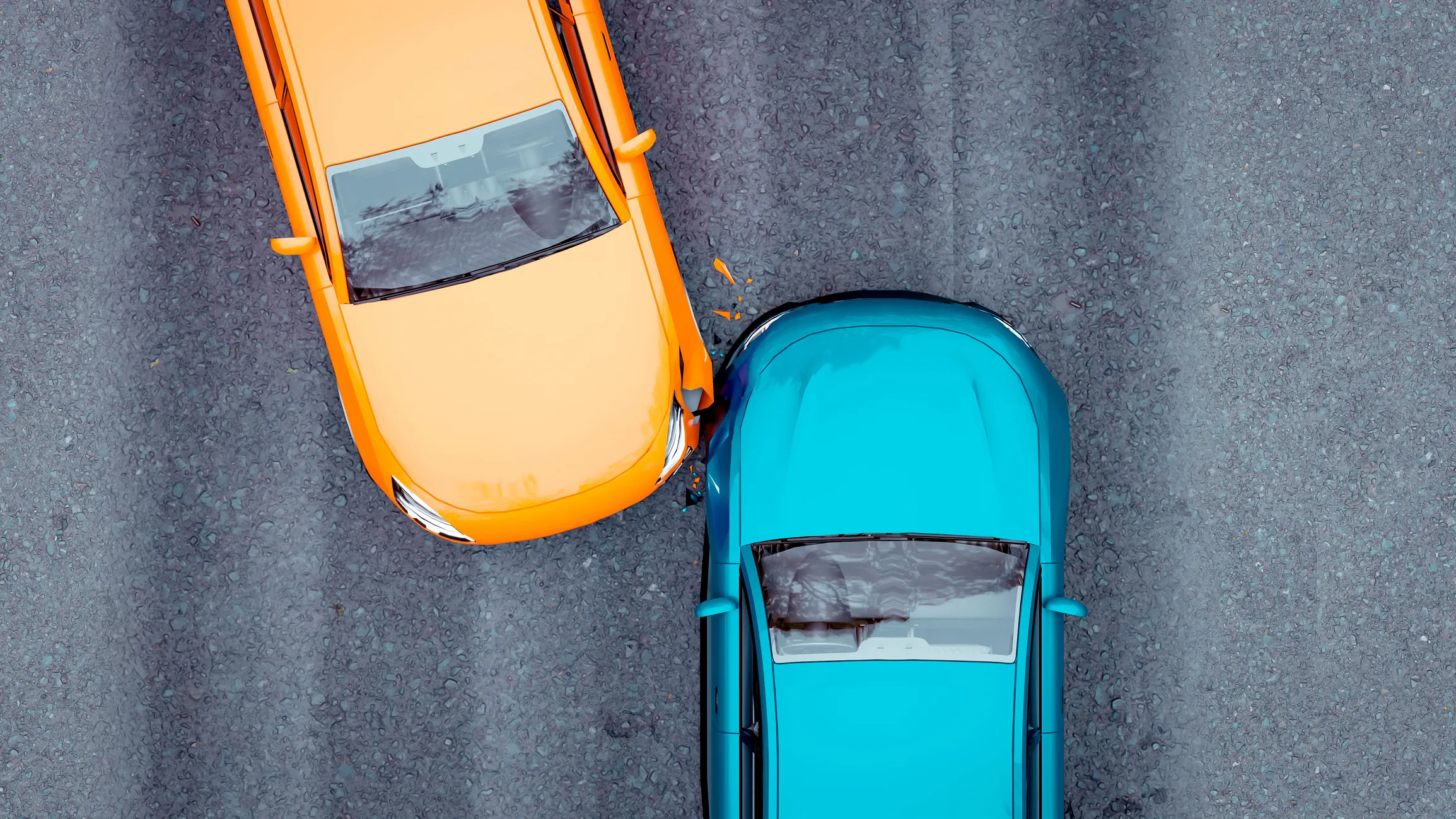 Aerial view of an orange car and a blue car colliding on a grey asphalt road with orange paint chipping on impact.