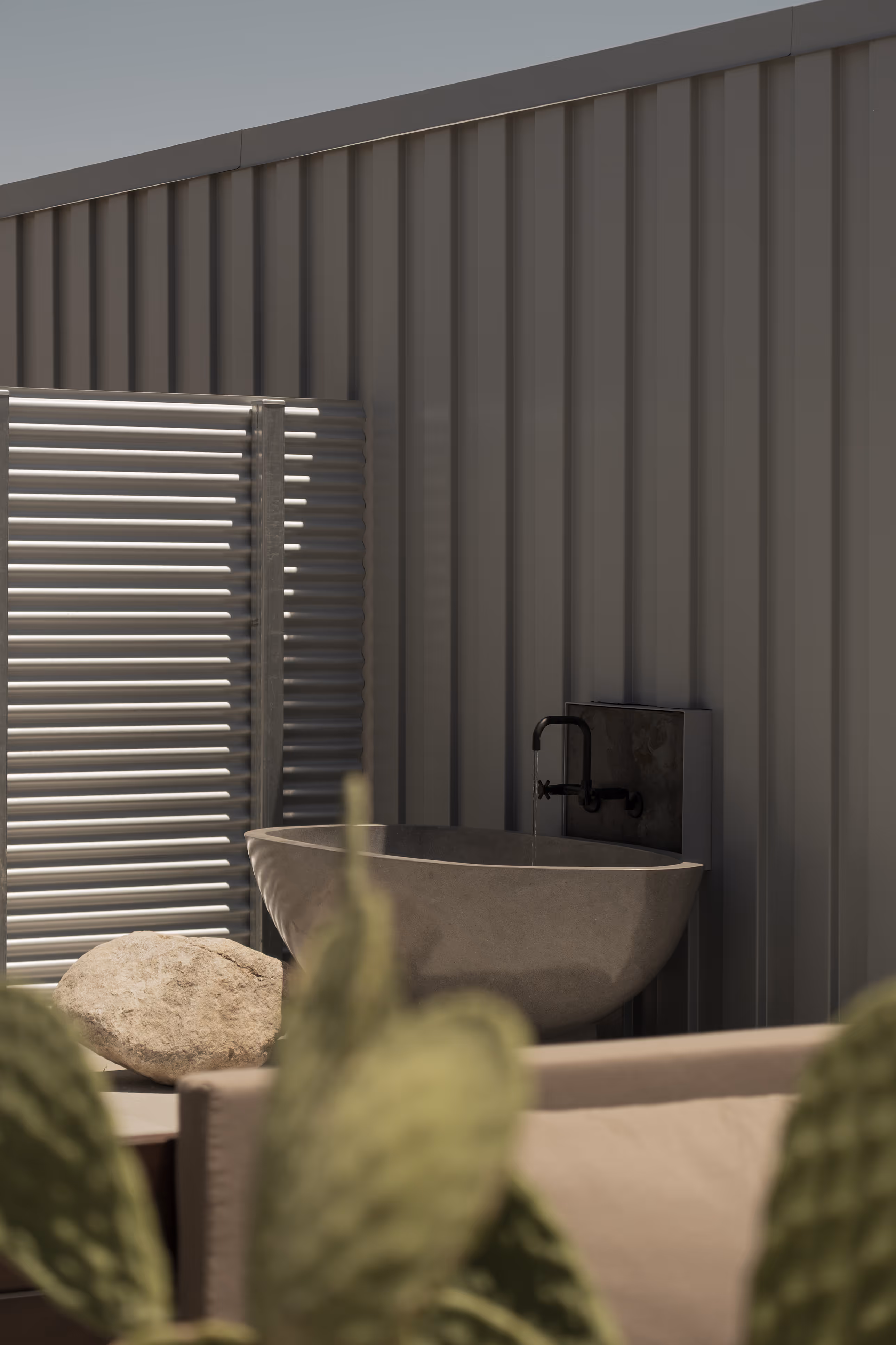 Outdoor bathroom at Reset Hotel, Twentynine Palms, with modern concrete basin and cactus