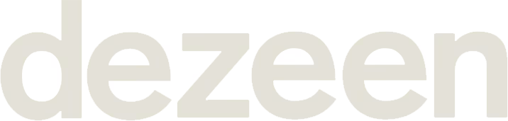 Minimalist "dezeen" logo in pale gray on white, reflecting modern design at Reset Hotel, Twentynine Palms