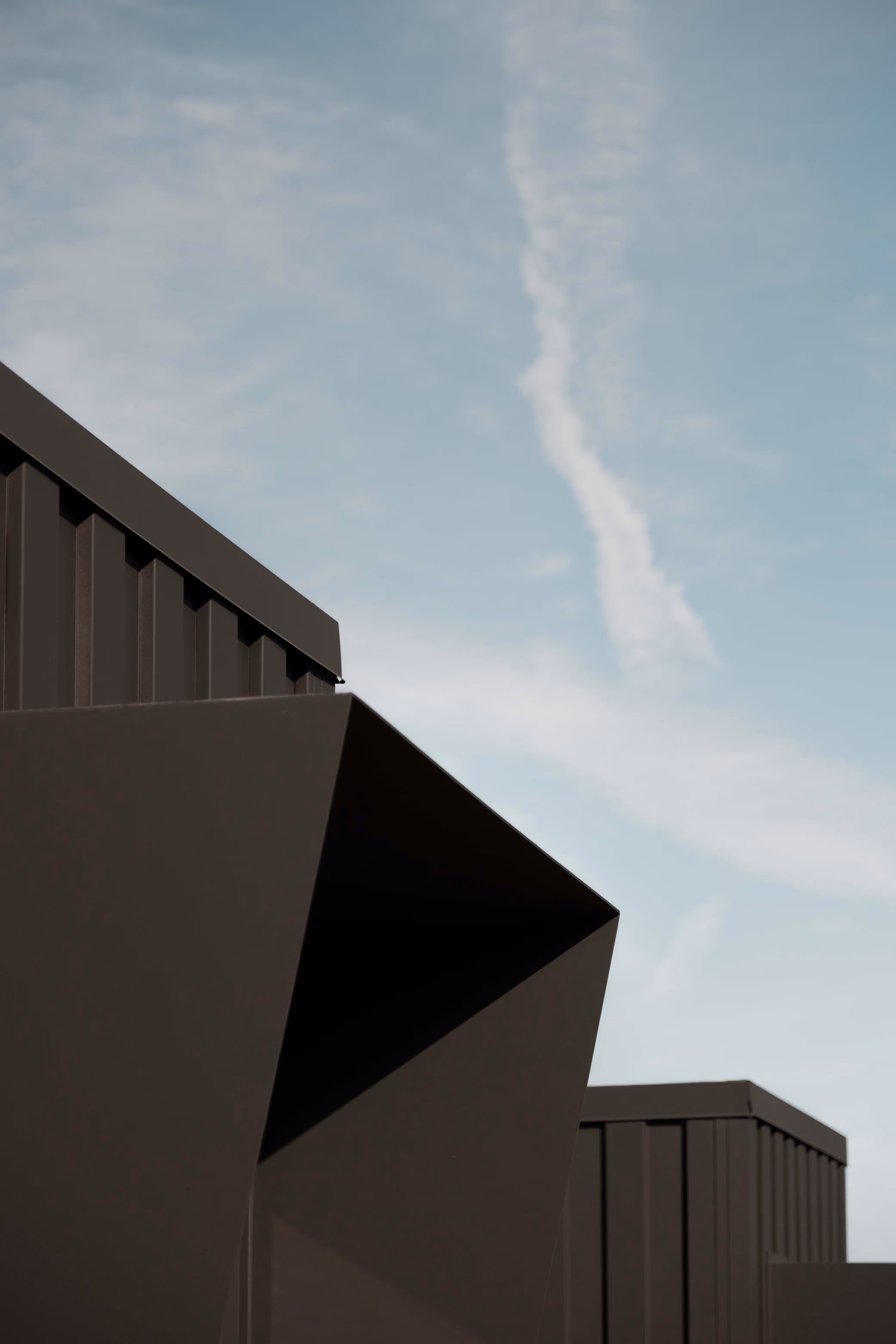 Reset Hotel rooms exterior in Twentynine Palms, a modern wood-clad desert stay with mountains