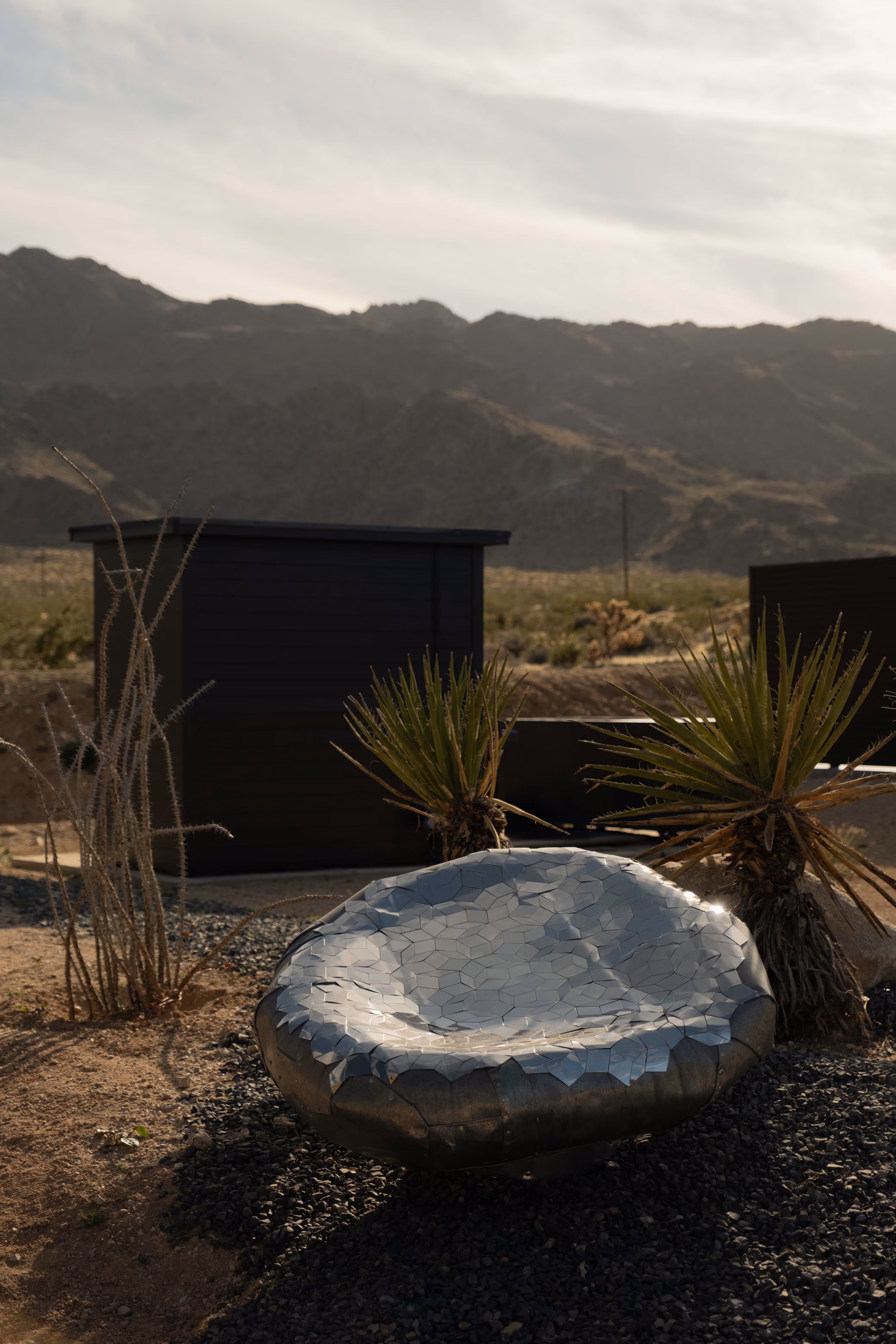 Reset Hotel rooms exterior in Twentynine Palms, a modern wood-clad desert stay with mountains