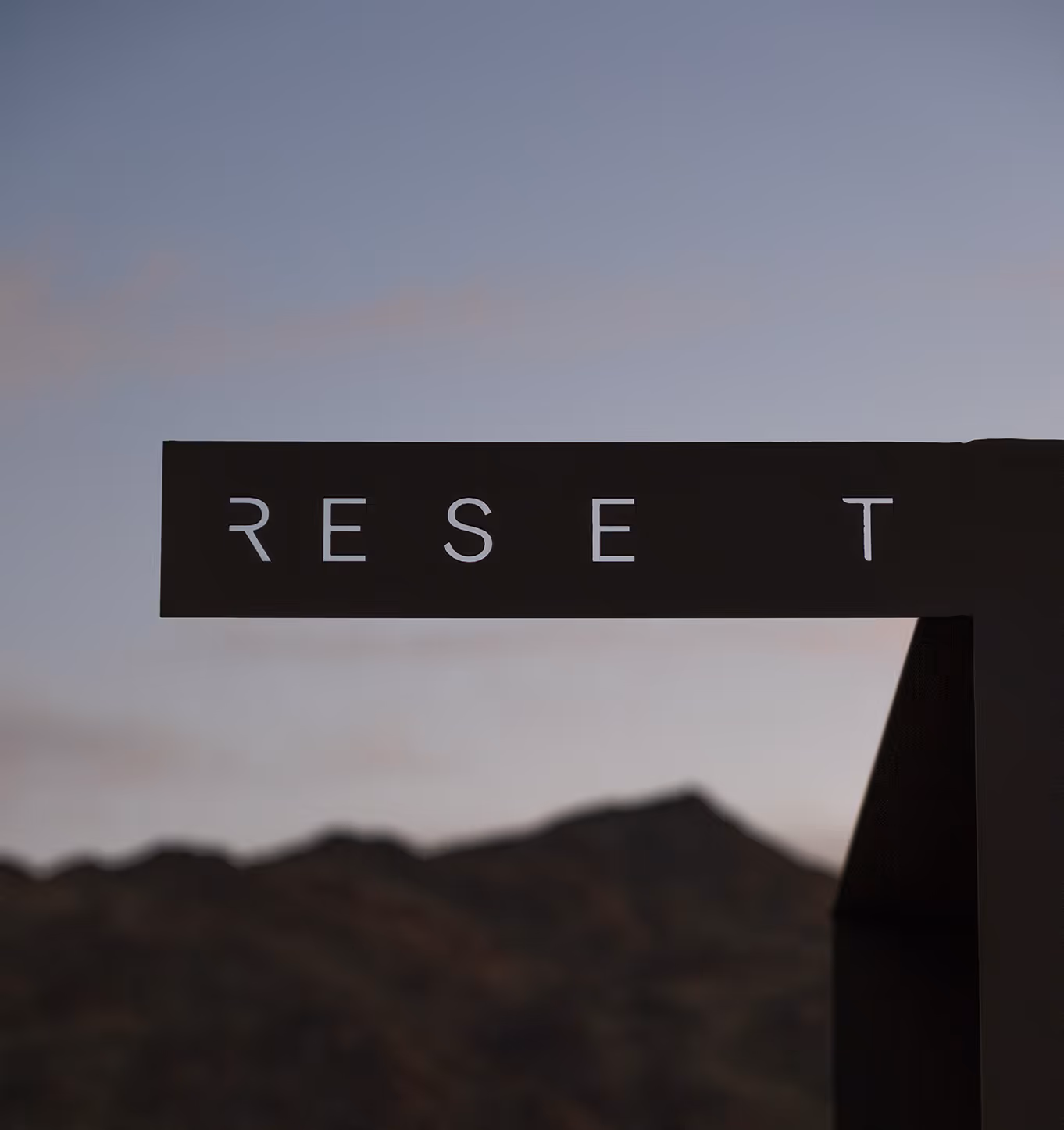 Reset Hotel rooms exterior in Twentynine Palms, a modern wood-clad desert stay with mountains