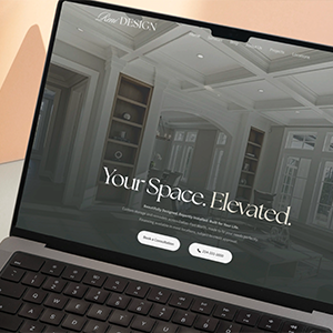 Woman having a video call with another woman on a desktop computer in a softly lit room.