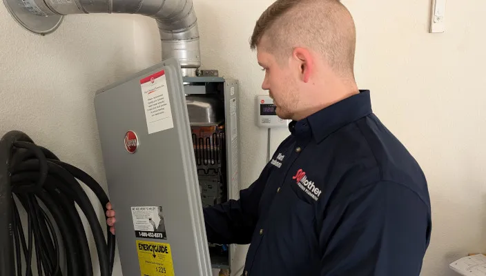 mother modern plumbing, dallas plumber performs tankless water heater maintenance