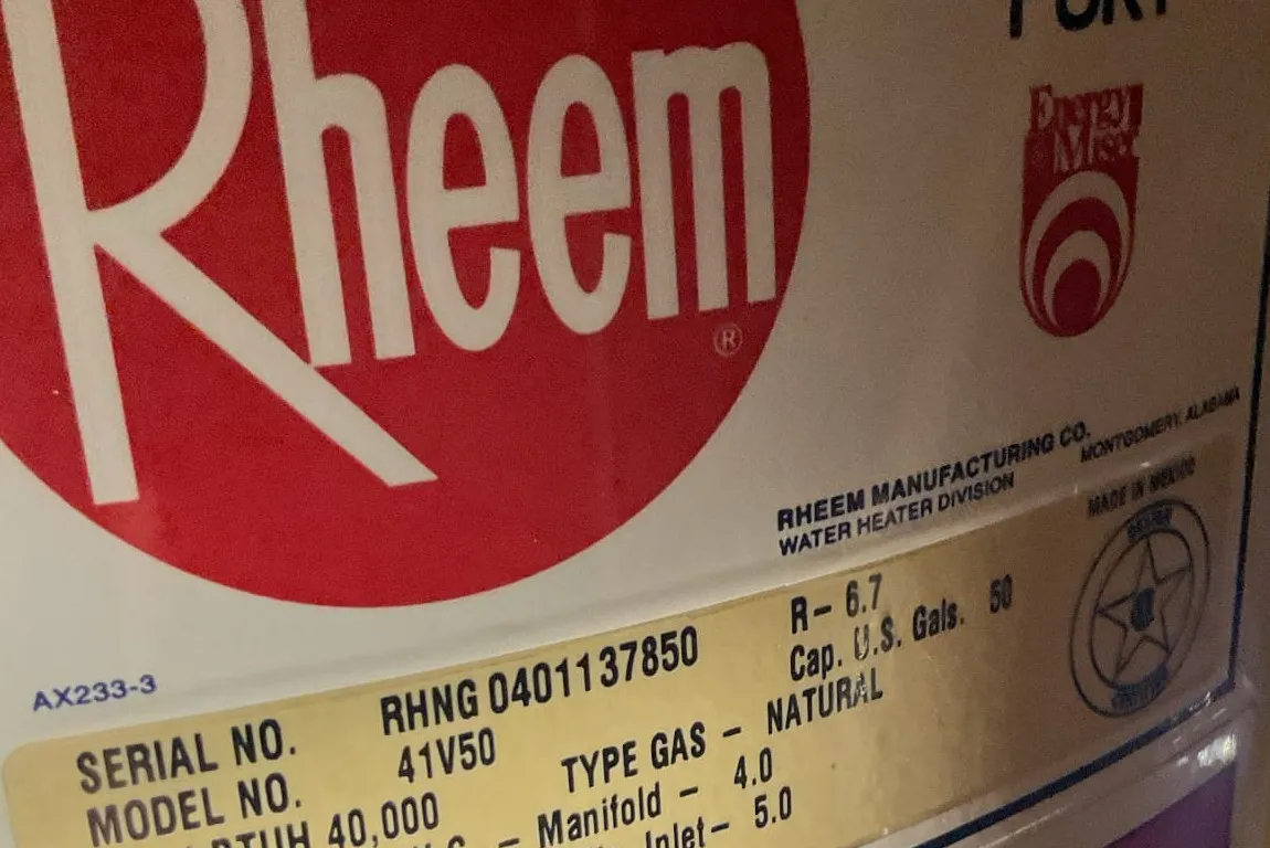 rheem gas water heater tank information label close up