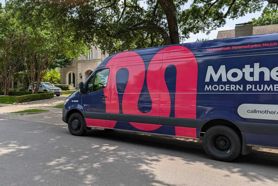 mother modern plumbing van at sewer line service call in Dallas