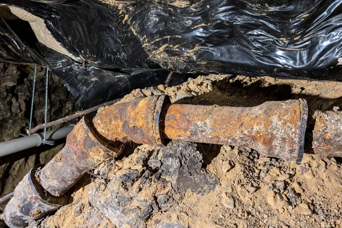 outdated cast iron sewer pipe in dallas, texas backyard