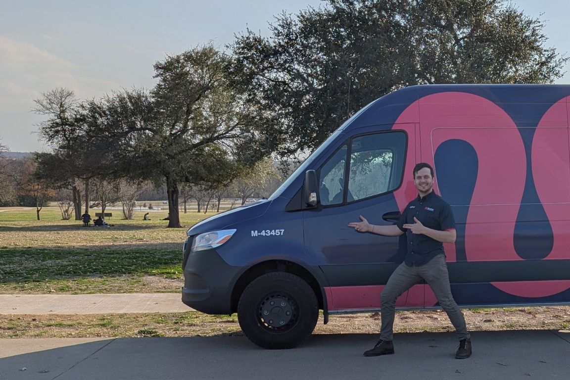 Photo of a uniformed plumber in White Rock | Dallas, TX from Mother Modern Plumbing standing and smiling