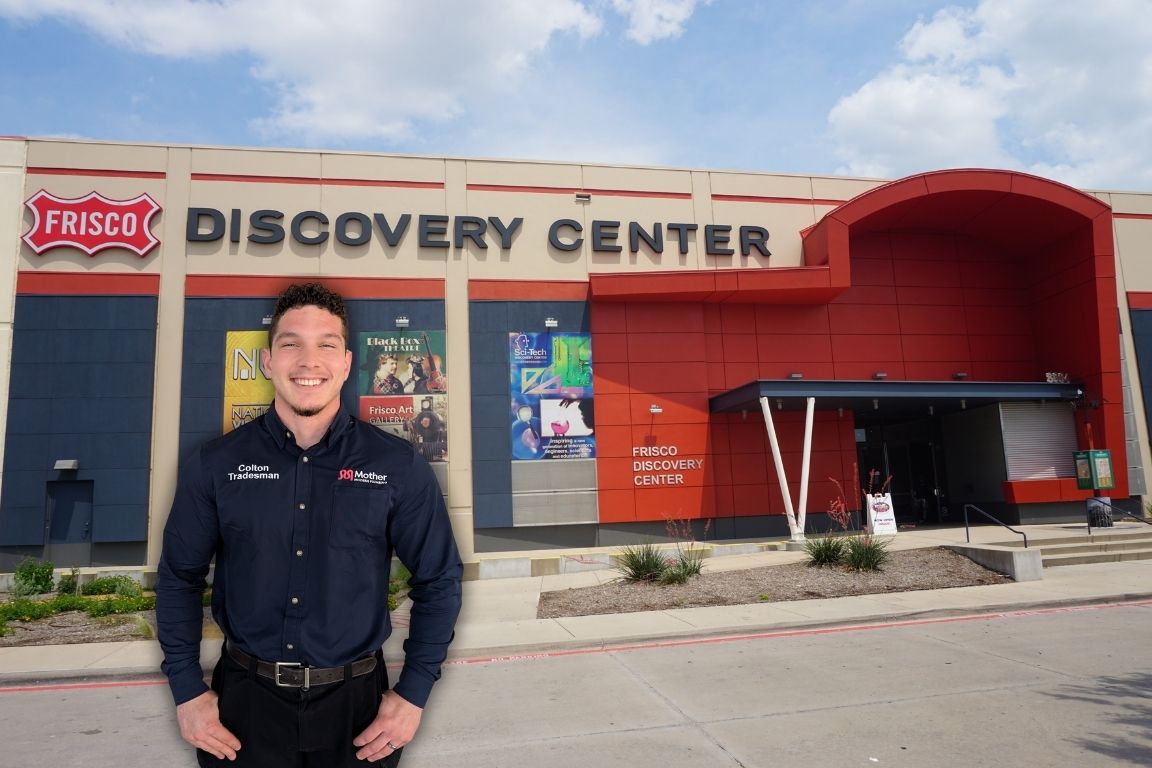 Photo of a uniformed plumber in Frisco, TX from Mother Modern Plumbing standing and smiling