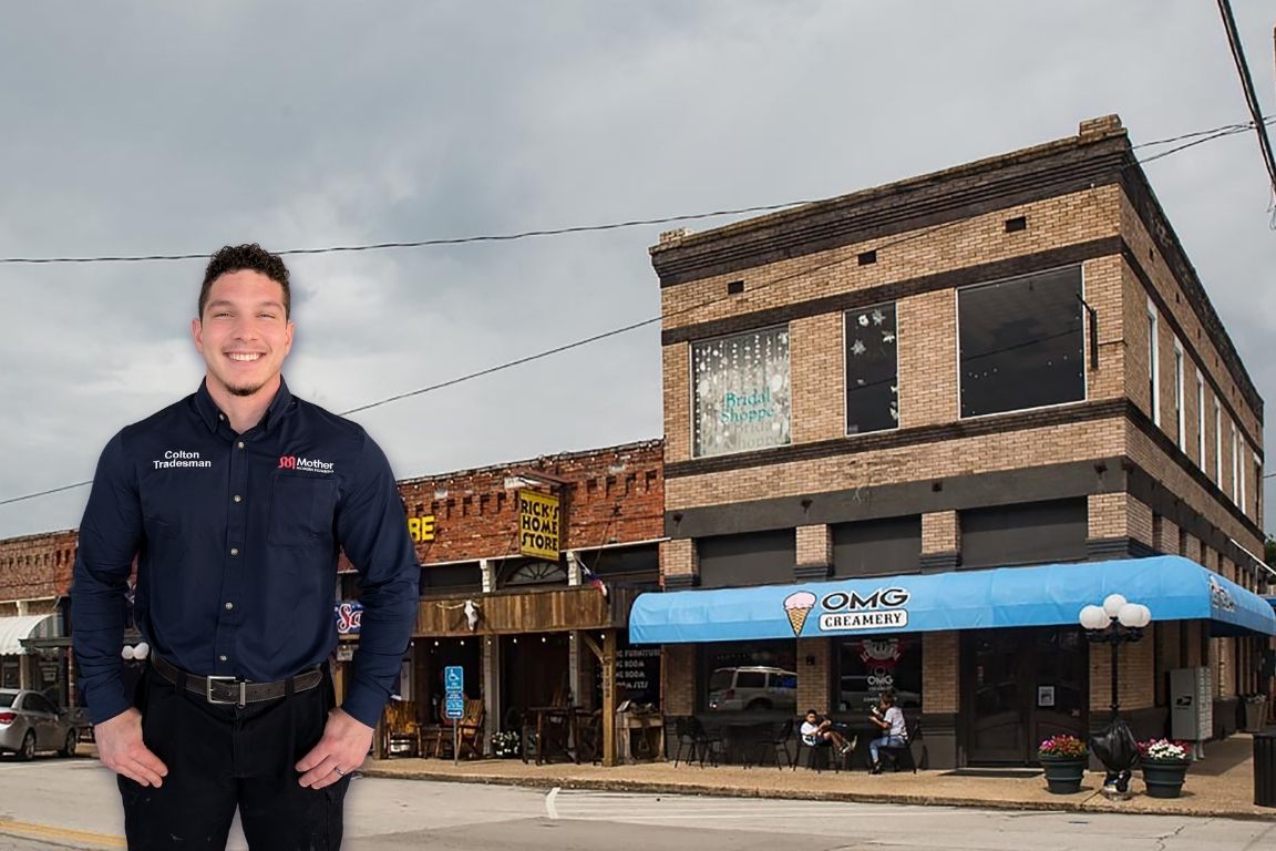 Photo of a uniformed plumber in Wylie, TX from Mother Modern Plumbing standing and smiling