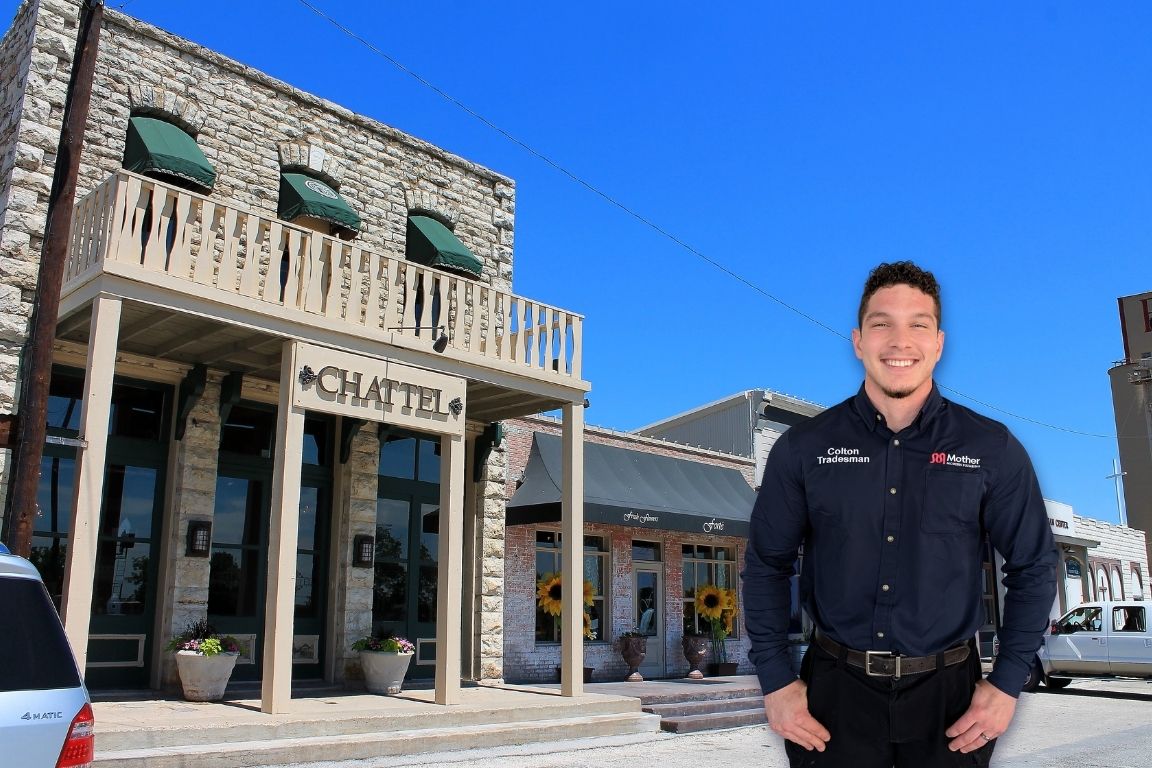 Photo of a uniformed plumber in Aledo, TX from Mother Modern Plumbing standing and smiling