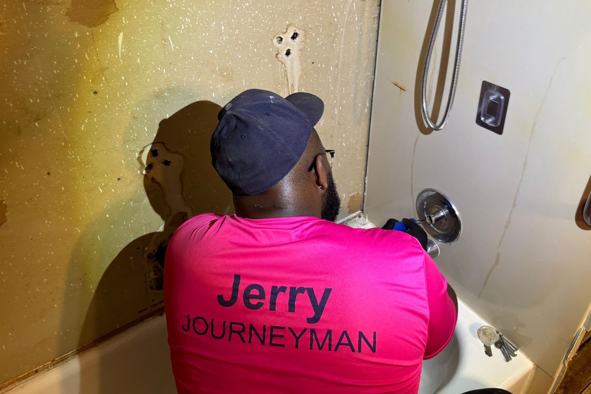 A plumber from Mother Modern Plumbing performing Shower Cartridge Replacement in White Rock | Dallas