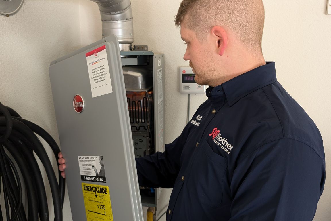 A plumber from Mother Modern Plumbing performing Descale Your Tankless Water Heater in White Rock | Dallas