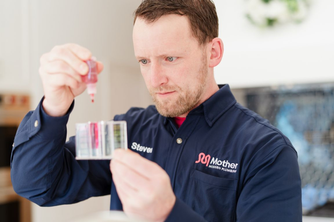 Mother Modern Plumbing Master Plumber conducts water quality test in Dallas, TX.