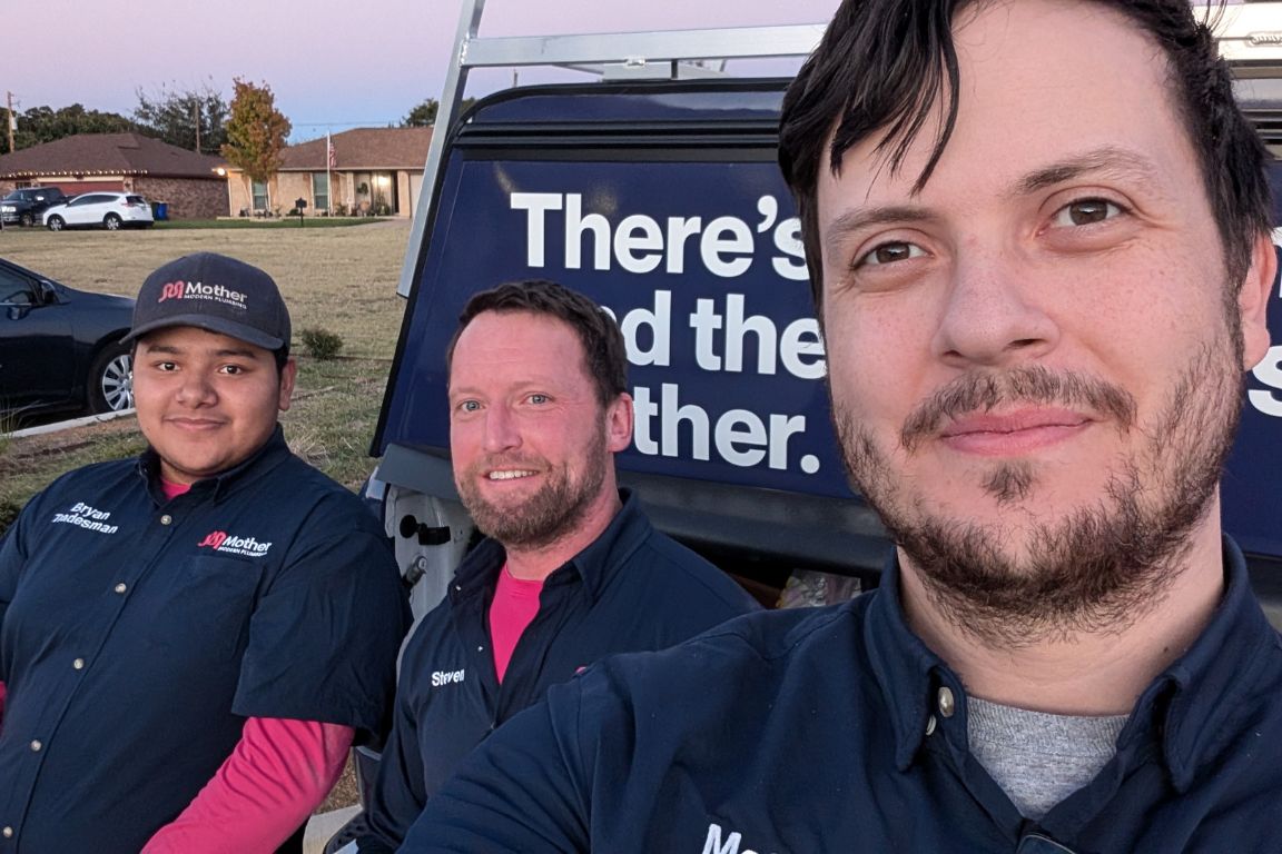 mother modern plumbing team at tankless water heater installation service call, dallas tx