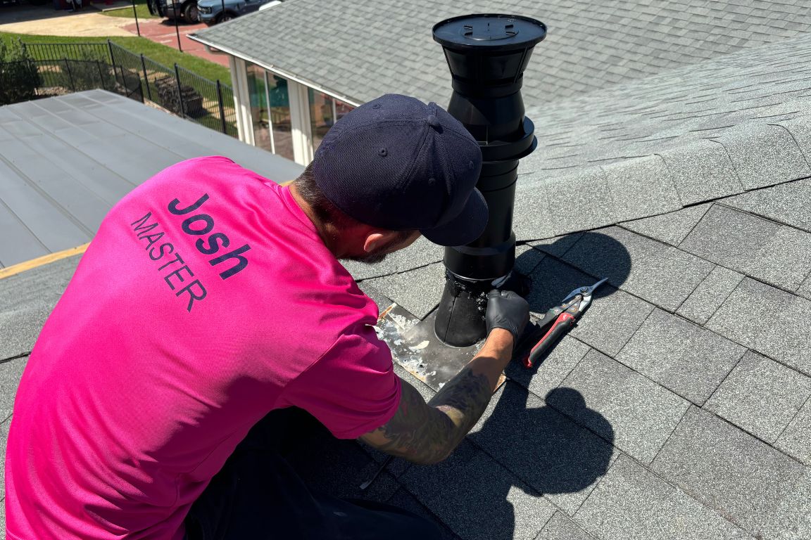 Master Plumber installs tankless water heater exhaust vent on roof of Dallas, TX home