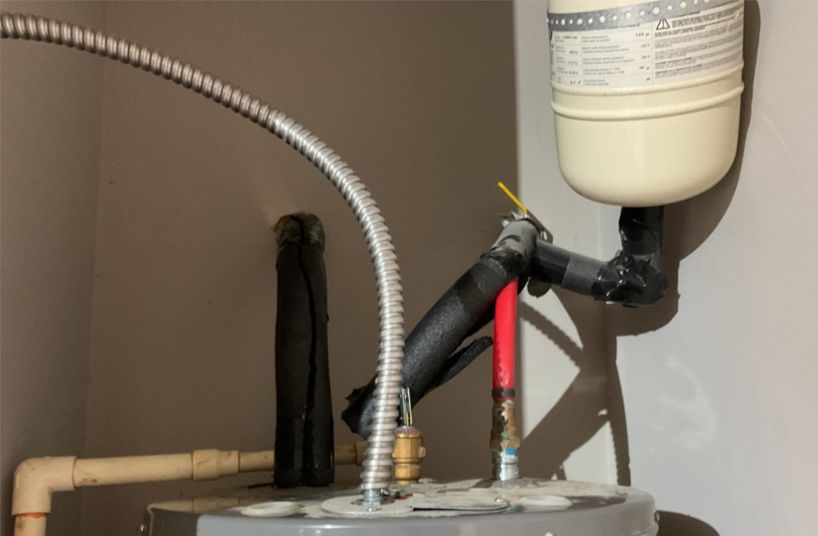 pipes and connections leading from conventional water heater, mother modern plumbing