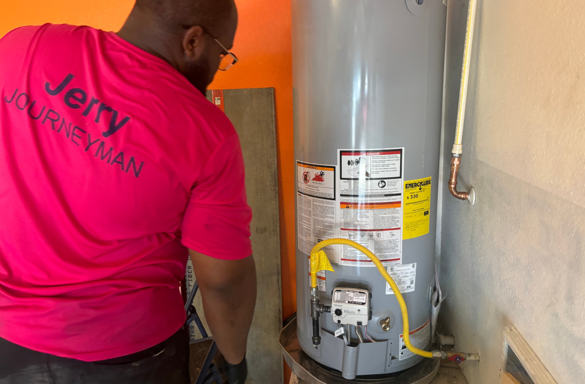 Mother Modern Plumbing approaches conventional water heater tank for annual flush service