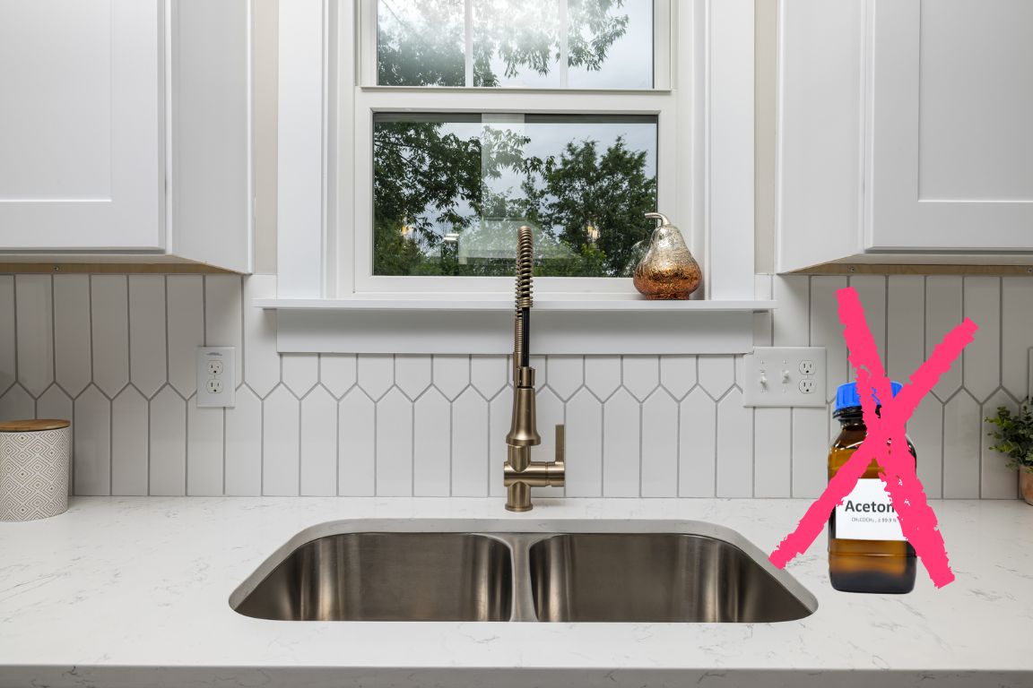 bottle acetone on sink counter with red x, do not pour acetone down the drain