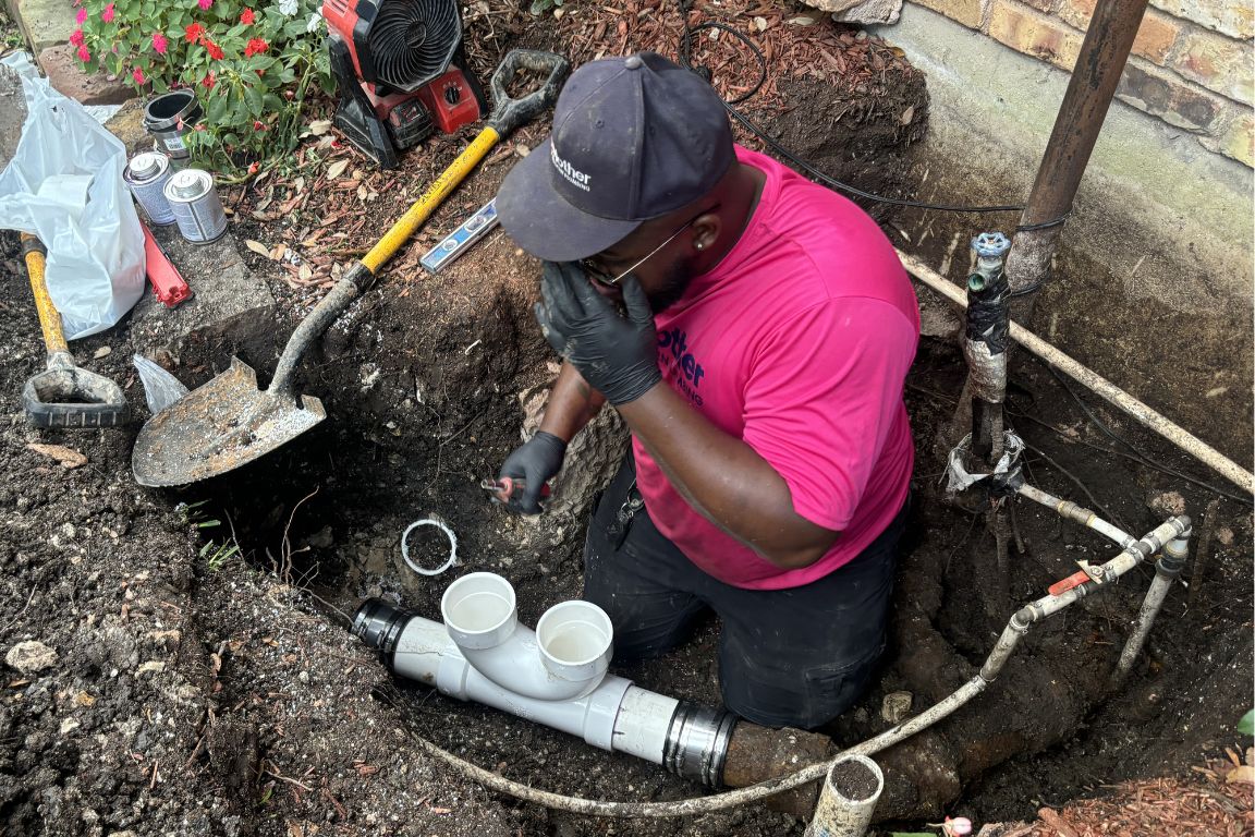 mother modern plumbing installs new sewer line cleanout in dallas, tx backyard