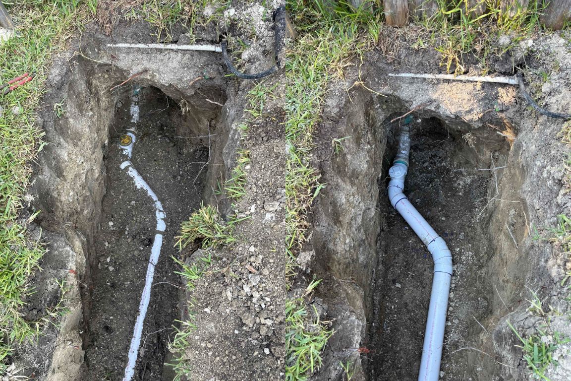 photos of water line replacement in richardson tx backyard with new pvc, mother mdoern plumbing