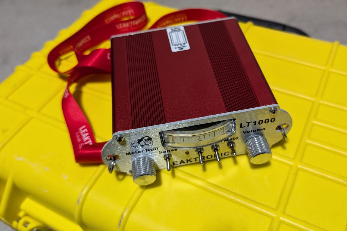 acoustic leak detection equipment sits on yellow briefcase, owned by mother modern plumbing