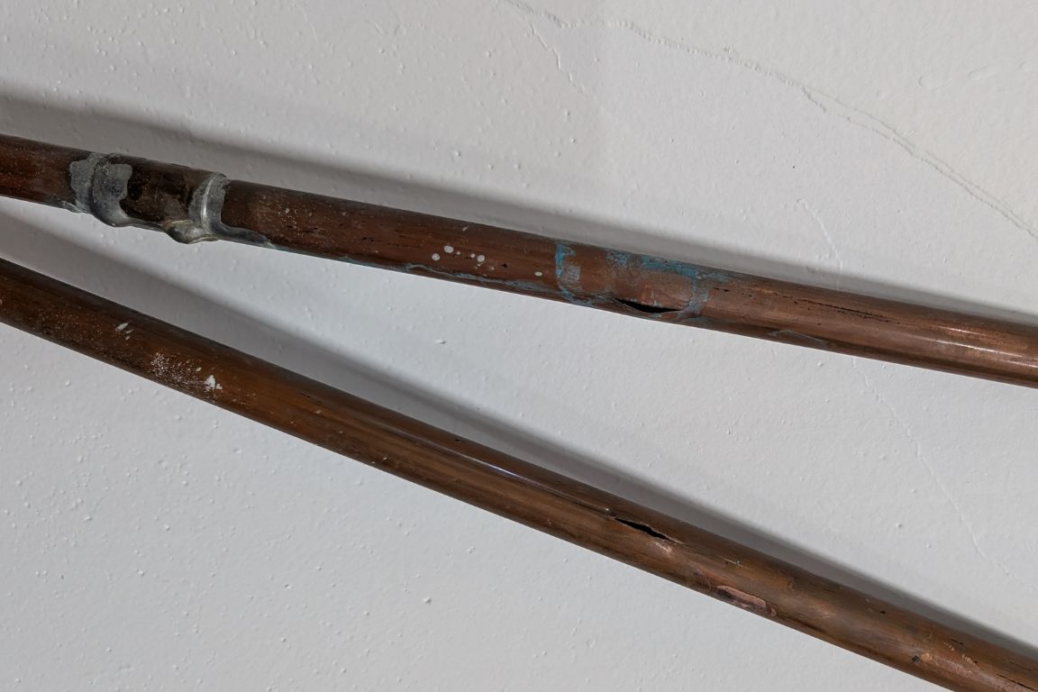 pair of copper water lines with 1-inch breaks removed from wall of lake worth, tx area home