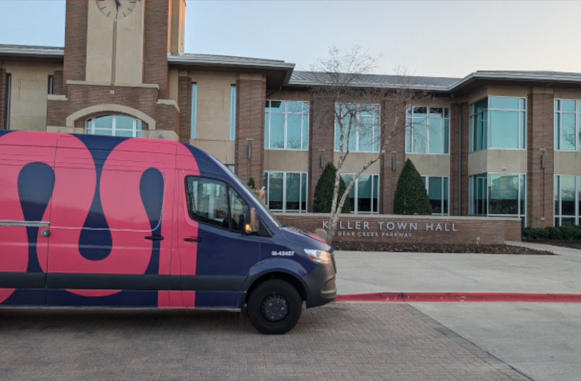 mother modern plumbing service van parked outside of keller town hall in keller, tx