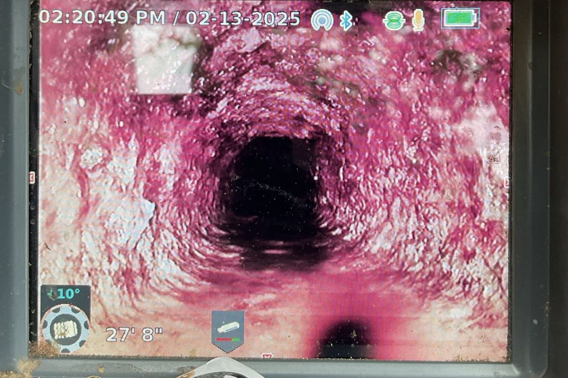 viewfinder of sewer line camera depicting inspection footage from main drain line