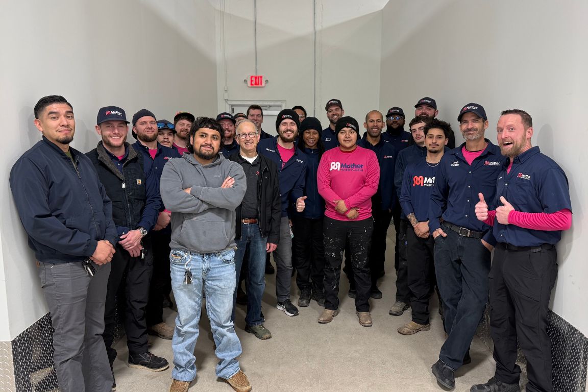 mother modern plumbing team poses in plano tx office before service in frisco