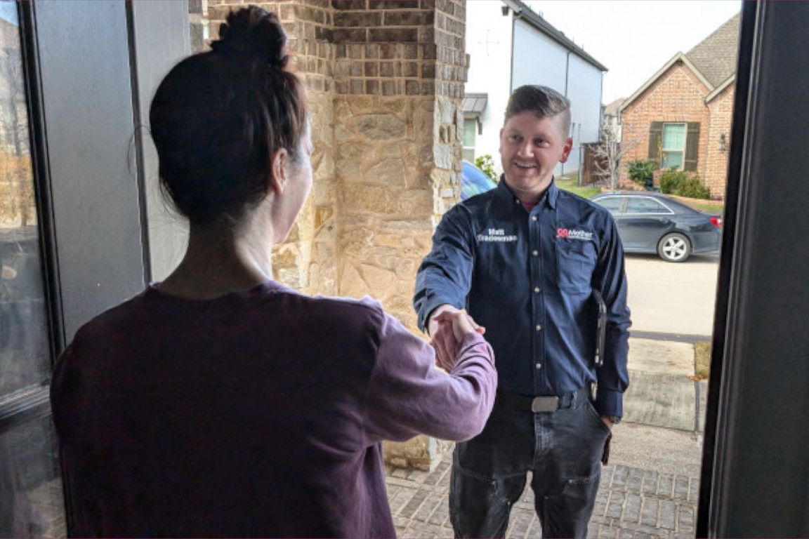 uniformed licensed plumber shakes hands with dallas tx homeowner after a sewer repair estimate and quote, mother modern plumbing