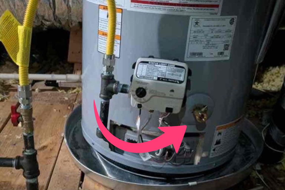 arrow pointing at drain valve on water heater tank to be drained during burst water heater emergency