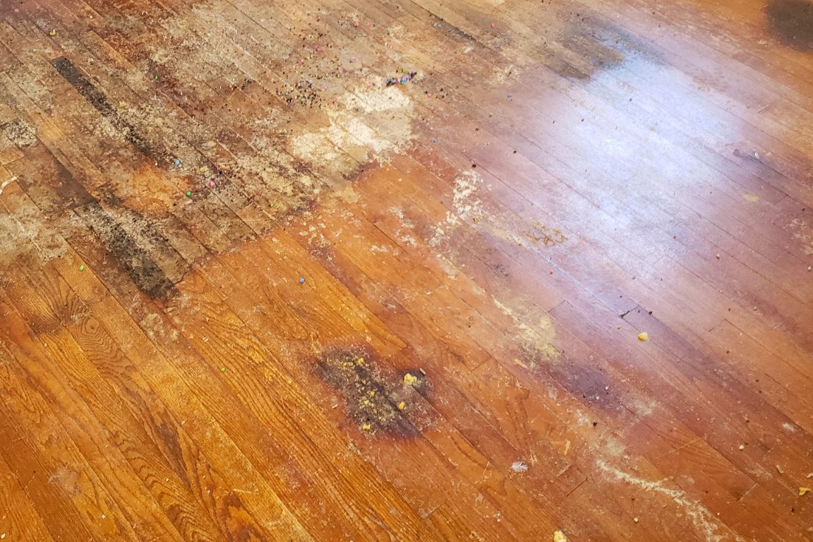 hardwood floor with water and mold damage from under-slab water line leak