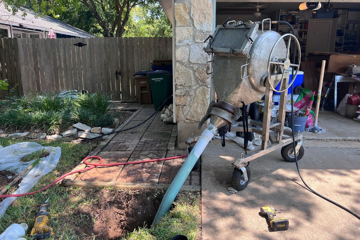 cipp lining equipment working outside plano tx garage to repair damaged sewer line, mother modern plumbing
