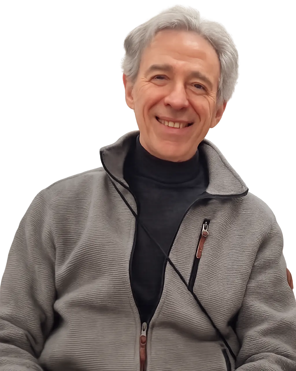 Smiling middle-aged man with gray hair wearing a gray zip-up jacket over a black shirt.
