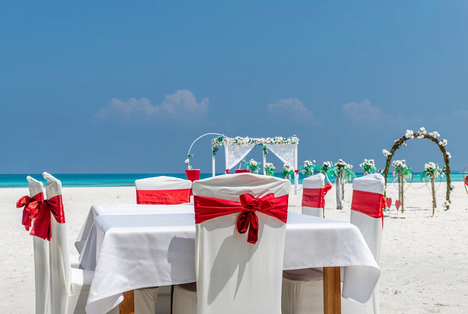 a spread of tables for a beach wedding