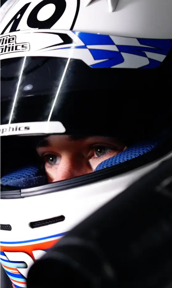 Riemer wearing a helmet, focused on his blue eyes, showing concentration
