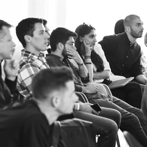 a group of people sitting next to each other