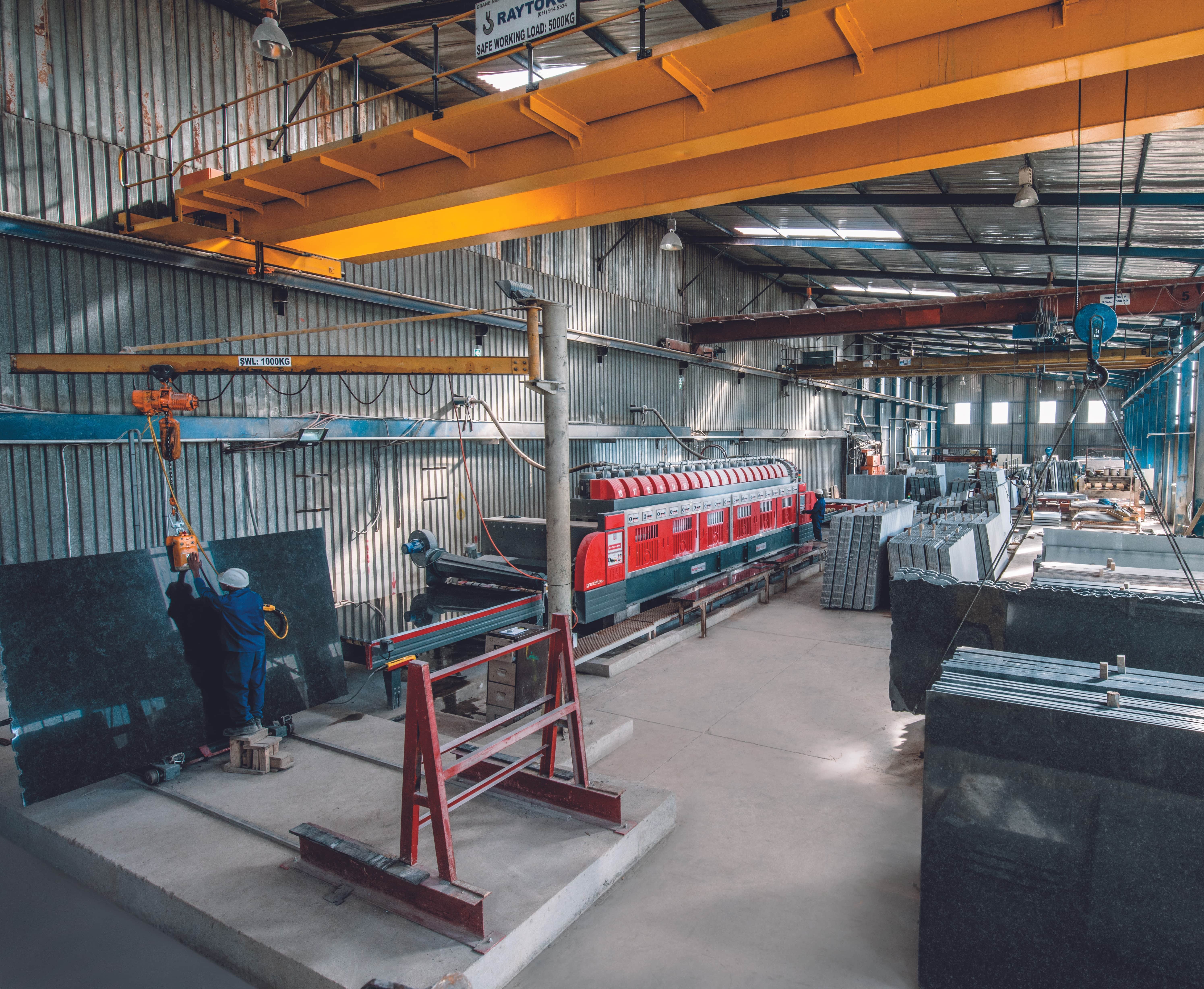 A wide shot of the Afrika National Granite polishing line.