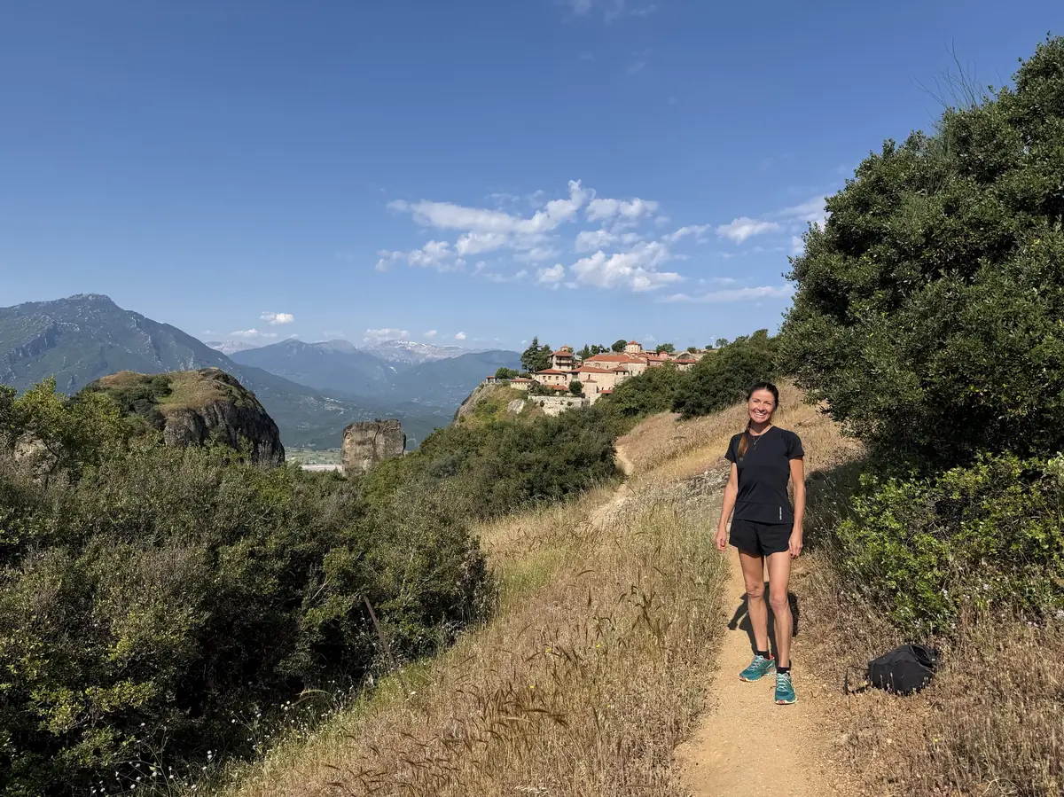 Hikers ascending a trail toward the monasteries of Meteora